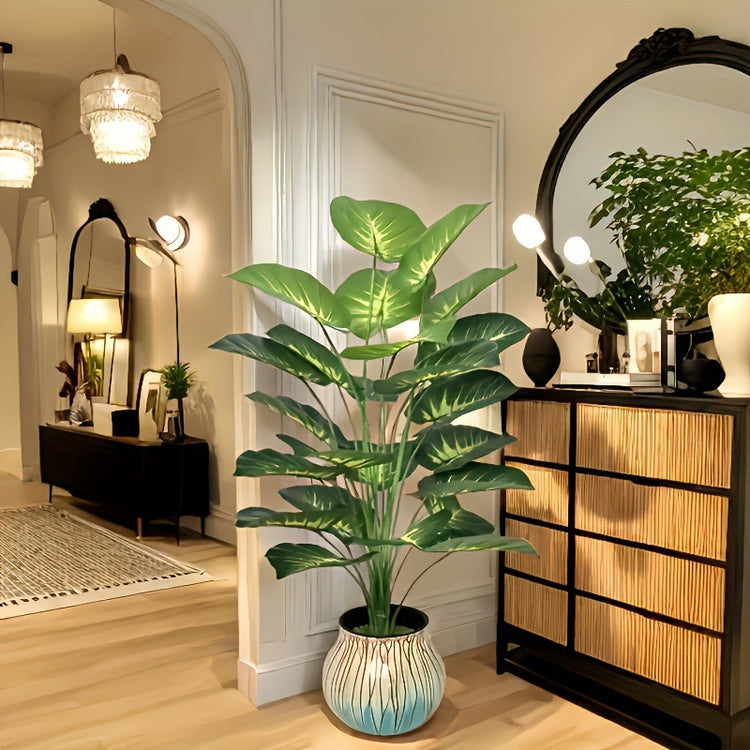 a room with a plant and a mirror