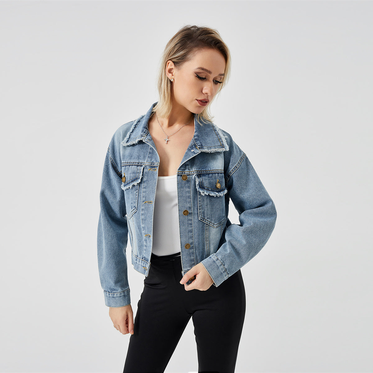 a woman in a denim jacket