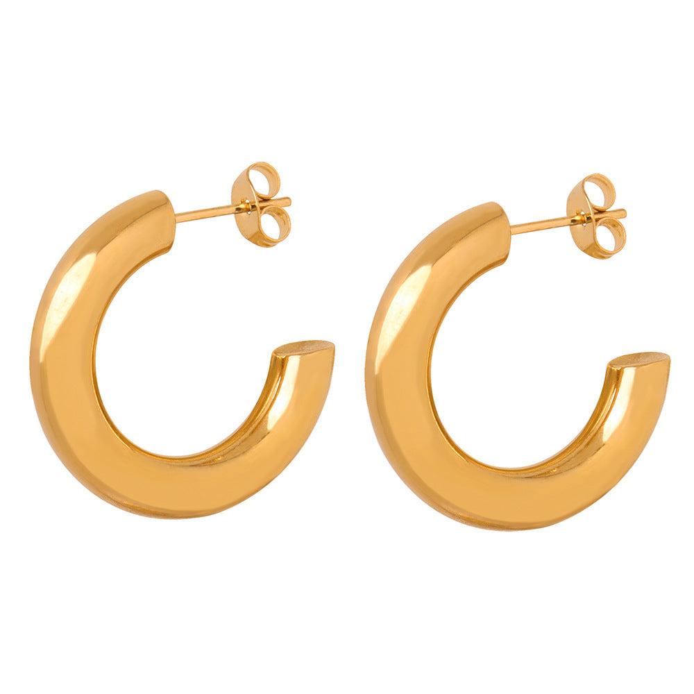 a pair of gold hoop earrings