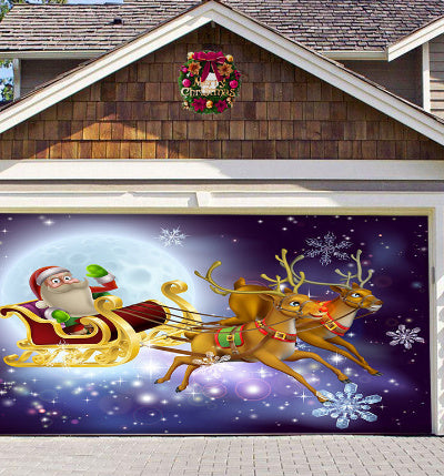 a garage door with a painting of santa claus flying in a sleigh