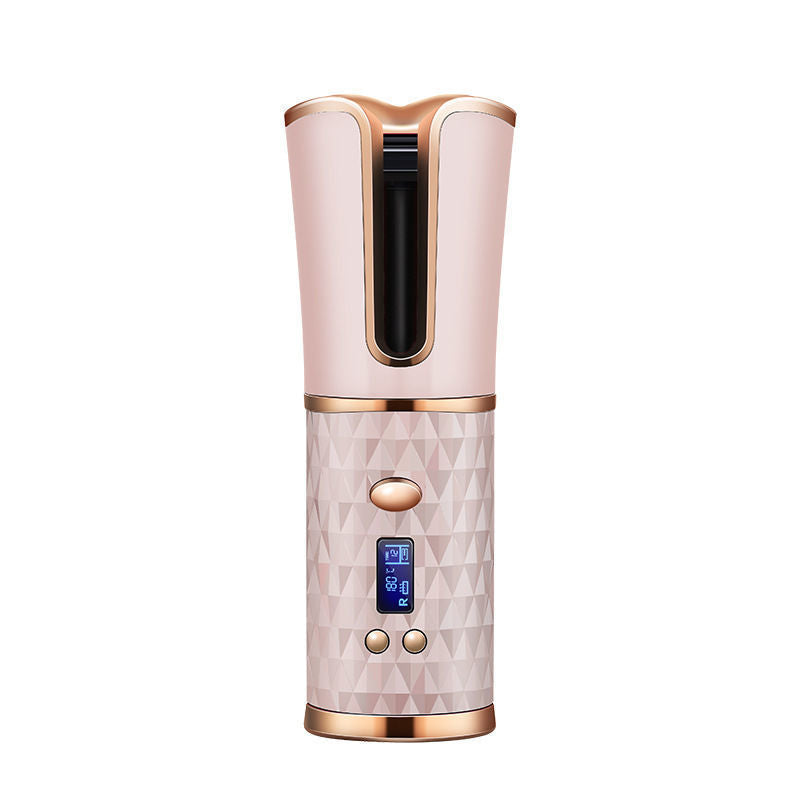 a hair dryer with a pink and gold design