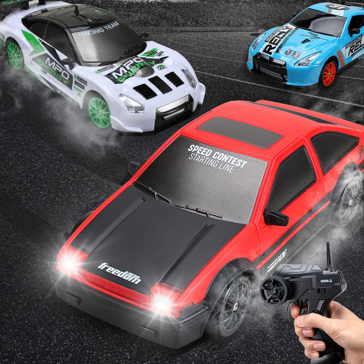 a hand holding a remote control car