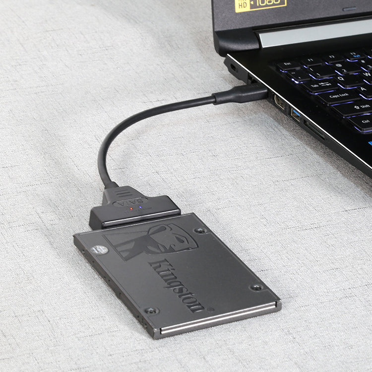 a laptop with a cable connected to it