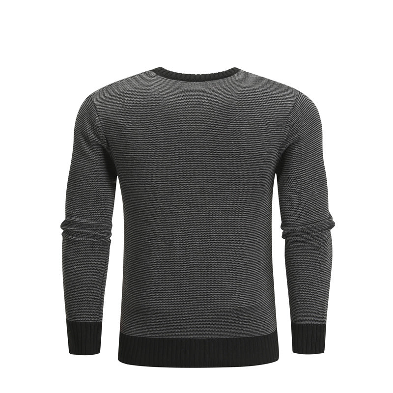 a black and grey sweater
