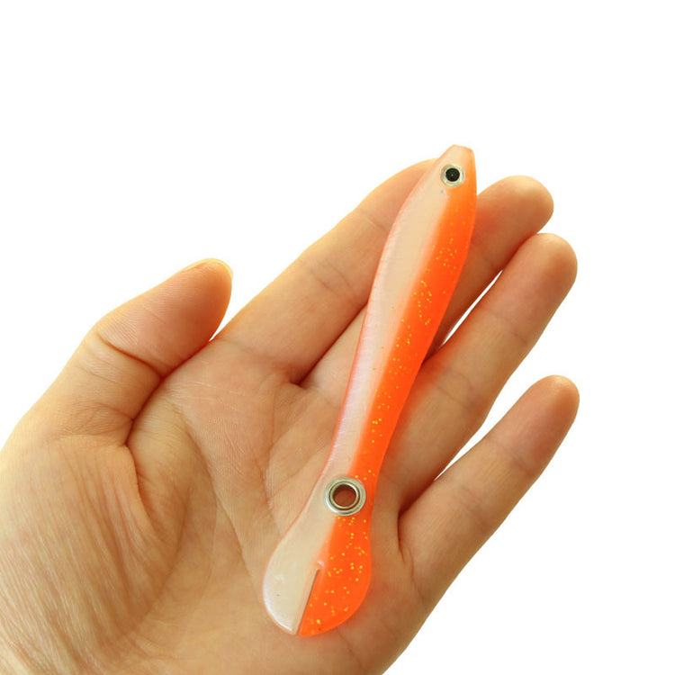 a hand holding a fishing lure