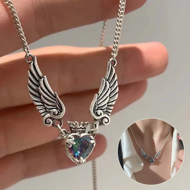 a hand holding a necklace