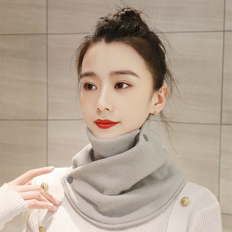 a woman with red lipstick and a scarf around her neck