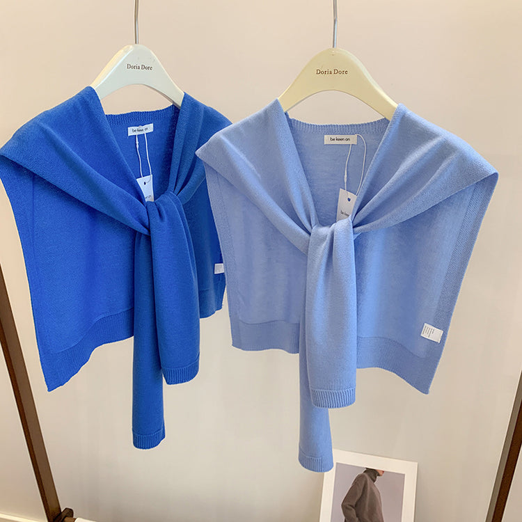 a pair of blue sweaters on a swinger