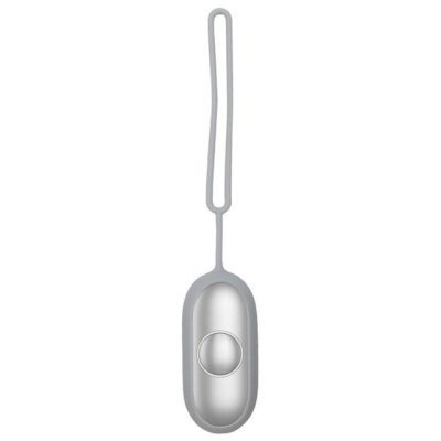 a silver object with a round button