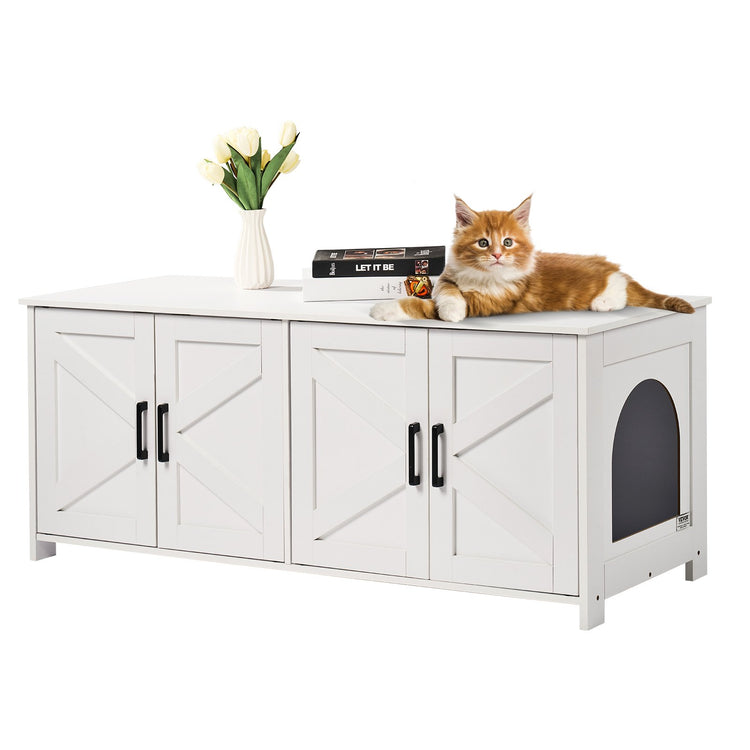 a cat lying on a white cabinet