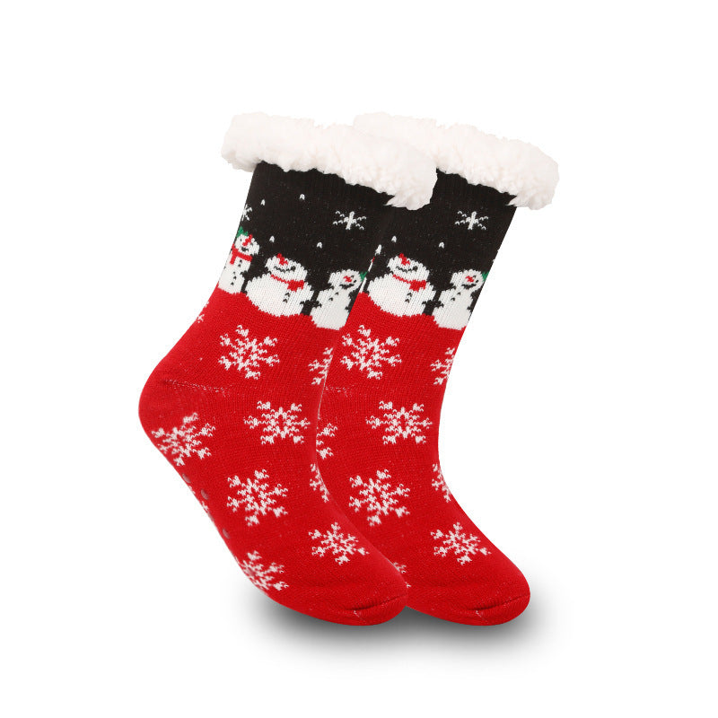 a pair of red and black socks with snowman designs