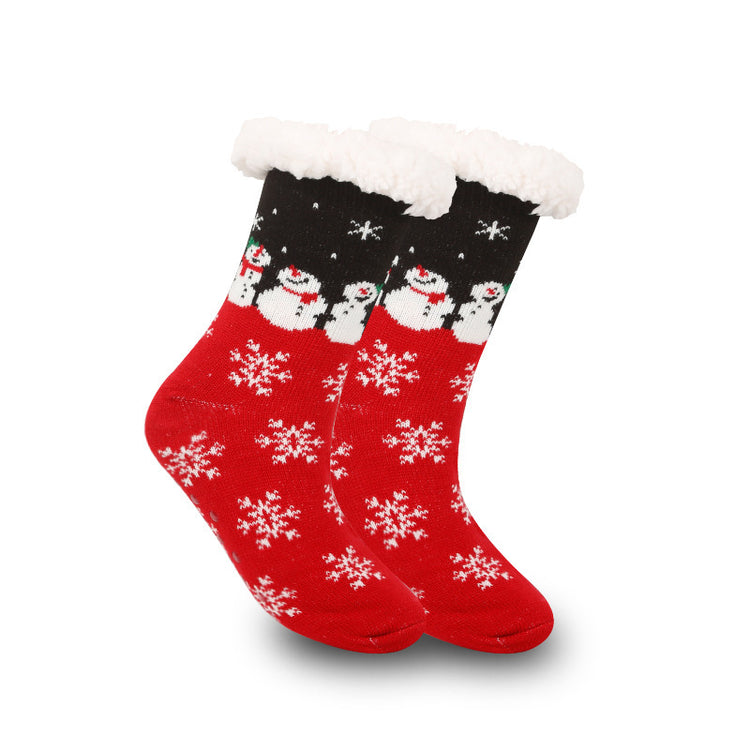 a pair of red and black socks with snowman designs