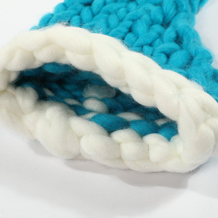 a knitted blue and white hat