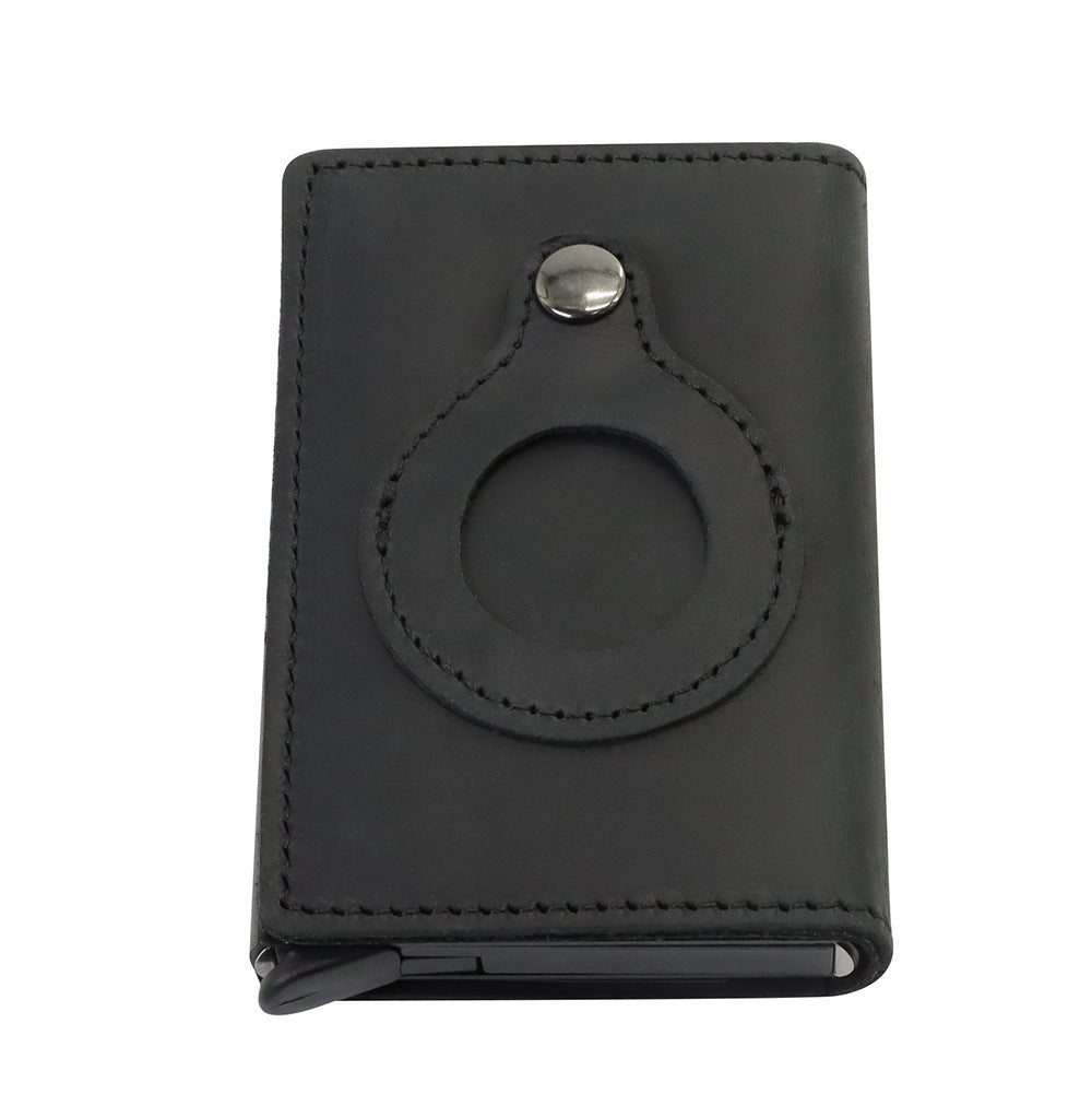 a black leather wallet with a circular design