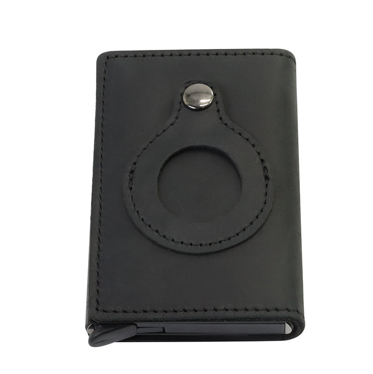 a black leather wallet with a circular design