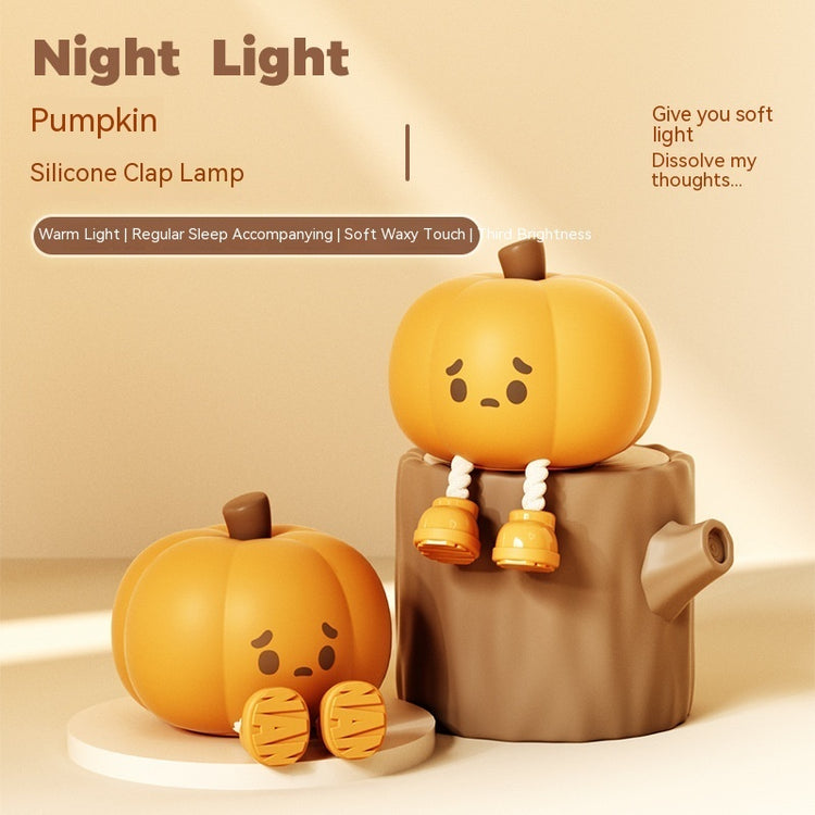 a couple of pumpkins on a tree stump