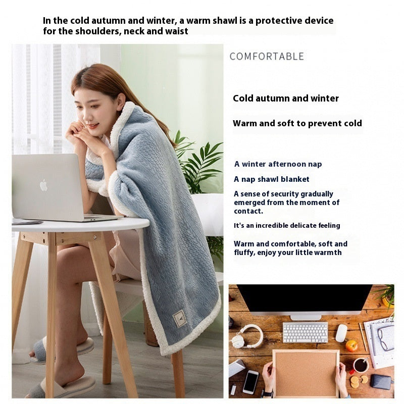 a woman sitting at a table with a laptop