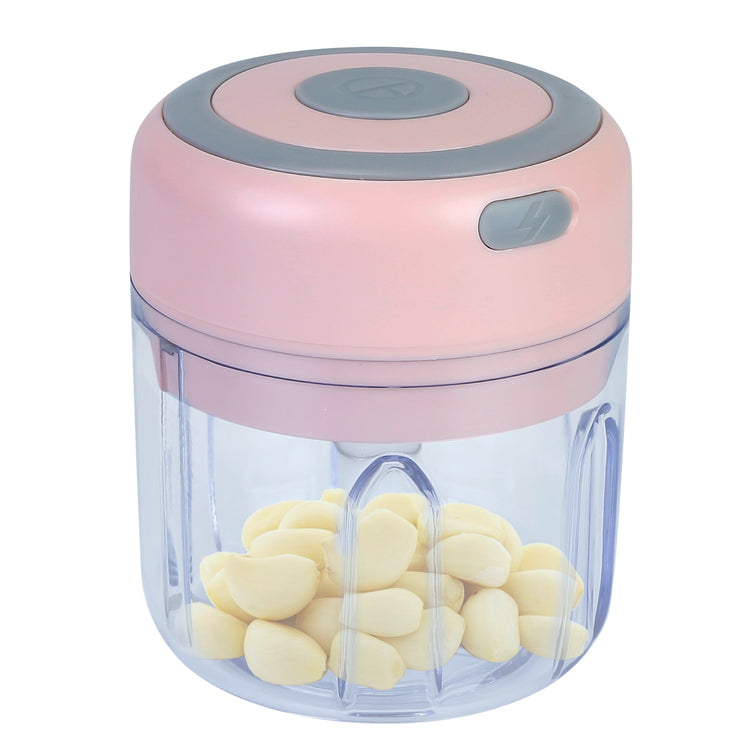 a pink and grey blender with a pink lid and white cloves inside