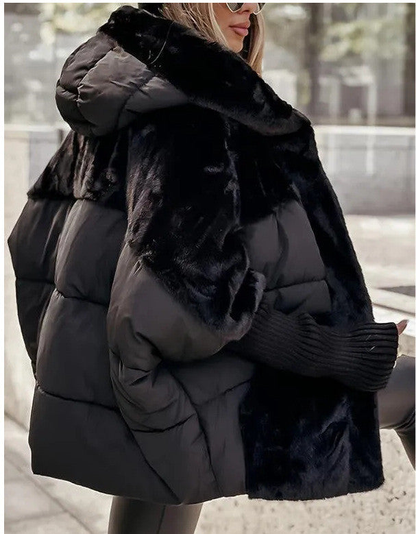 a woman wearing a black coat