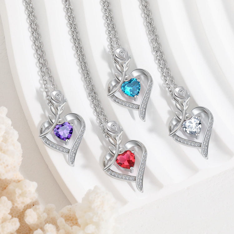 a group of necklaces on a white plate