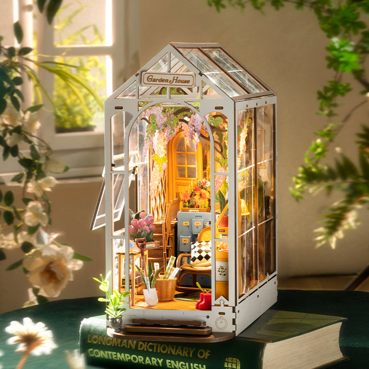 a miniature house on top of a book
