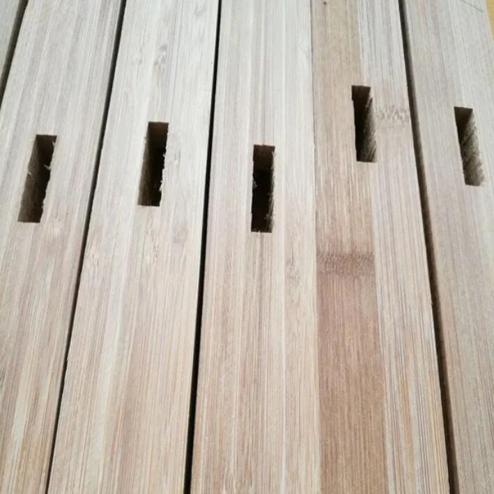 a group of wood planks with holes