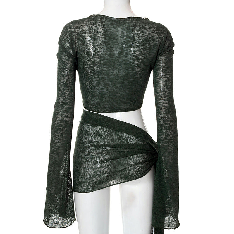 a mannequin wearing a green top and a skirt