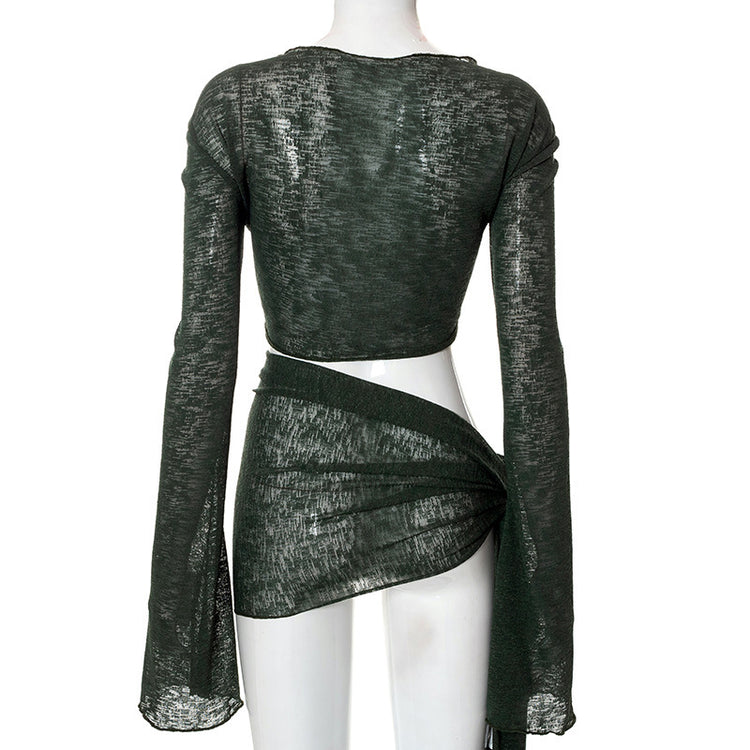 a mannequin wearing a green top and a skirt