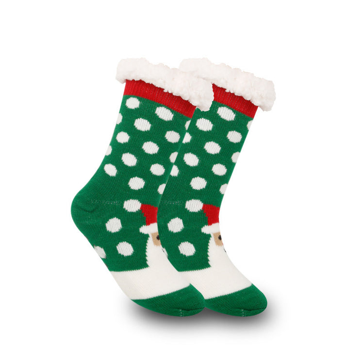 a pair of green and white socks with white dots