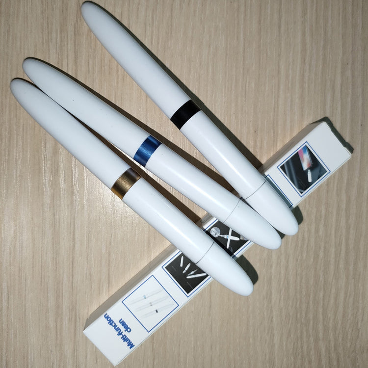 a group of white pens on a table