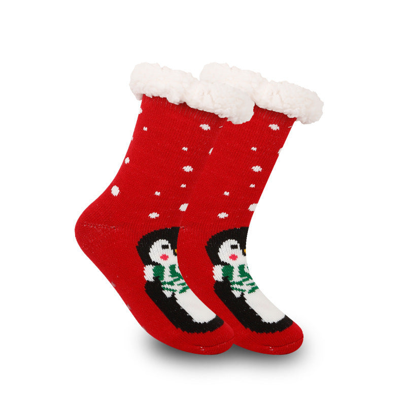 a pair of red socks with a penguin on them