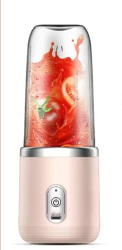 a blender with a tomato in it