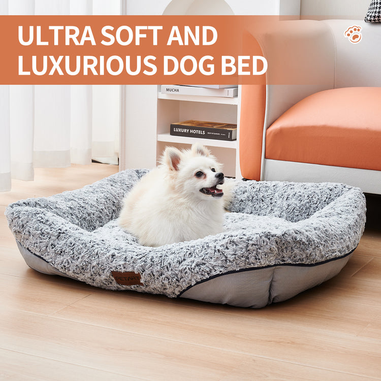 a dog lying in a dog bed