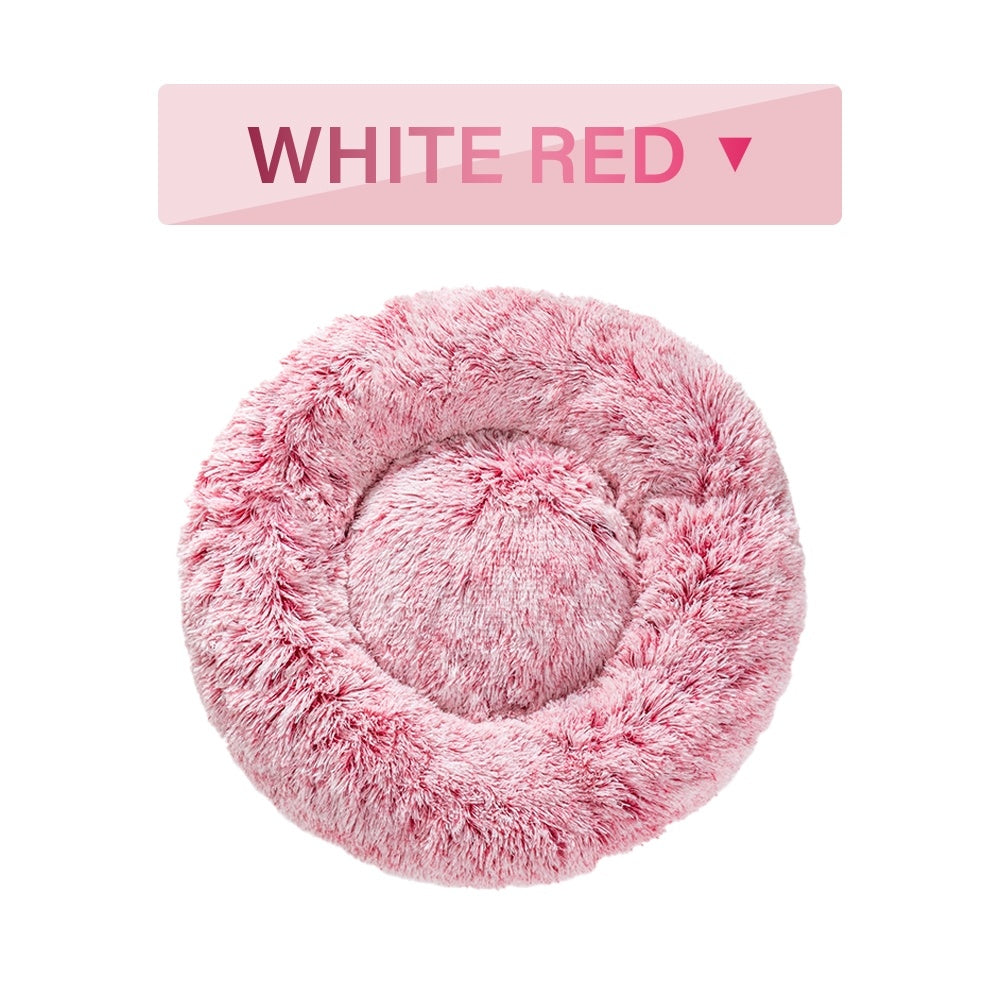 a pink fluffy pillow with text