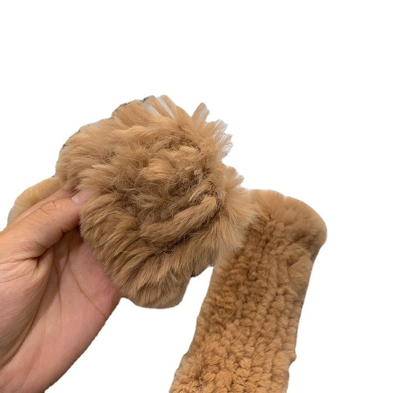 a hand holding a furry object
