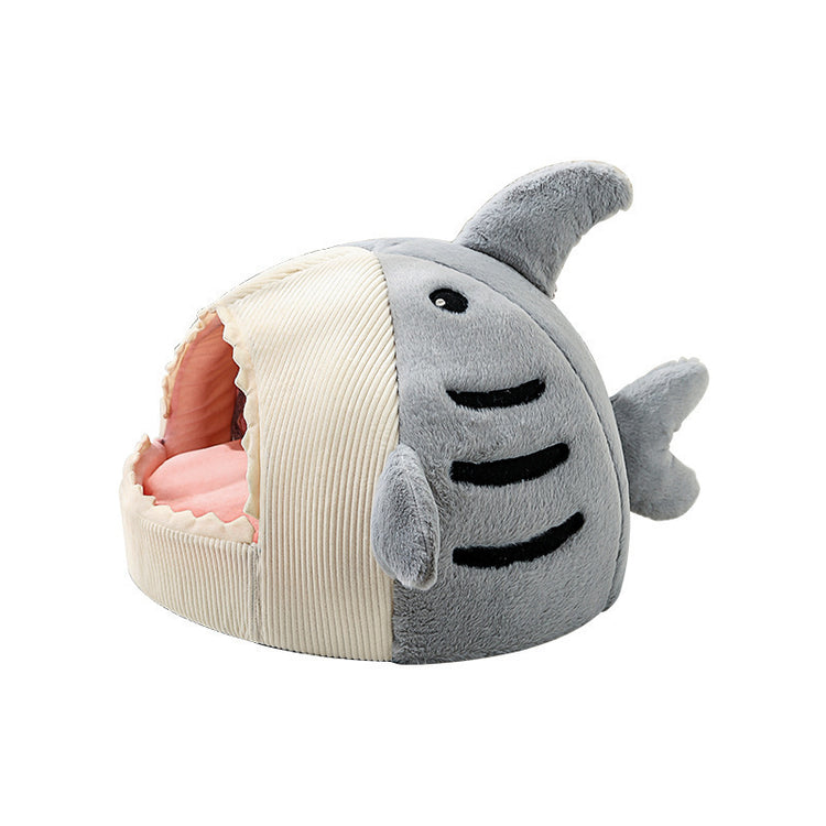a stuffed animal in a shark shape