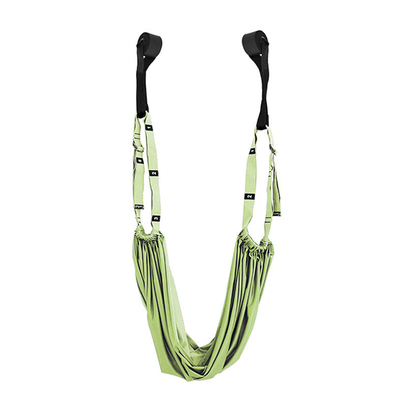 a green hammock from a wall