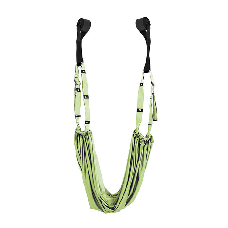 a green hammock from a wall