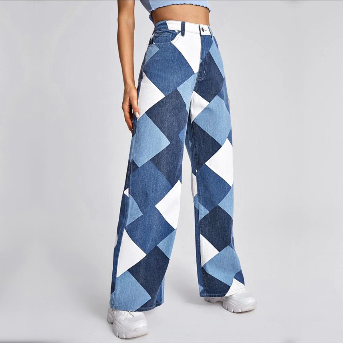 a person wearing a pair of blue and white checkered jeans