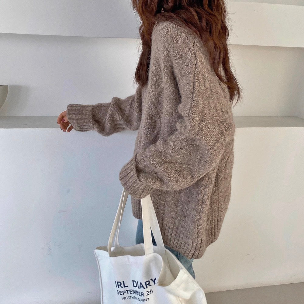 a woman walking down stairs with a bag