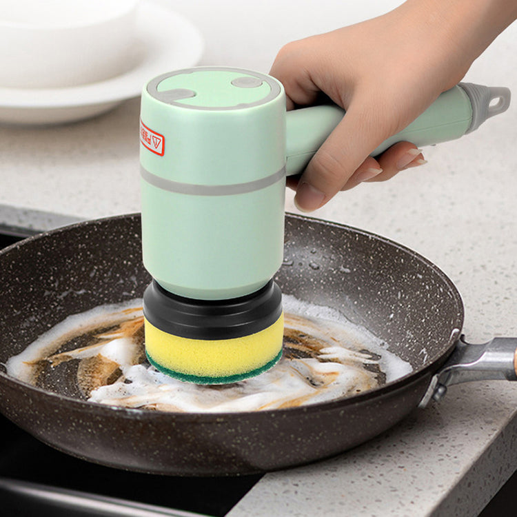 a hand holding a brush over a pan of food