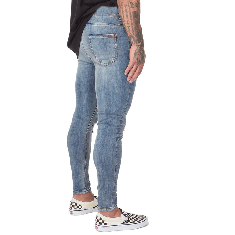 a person wearing jeans and a black shirt