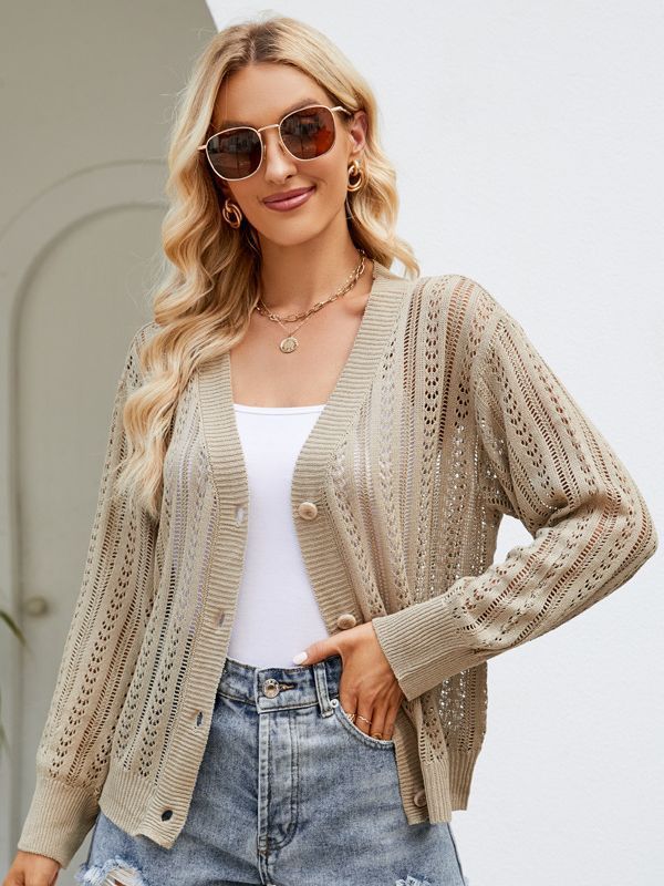 a woman wearing sunglasses and a sweater
