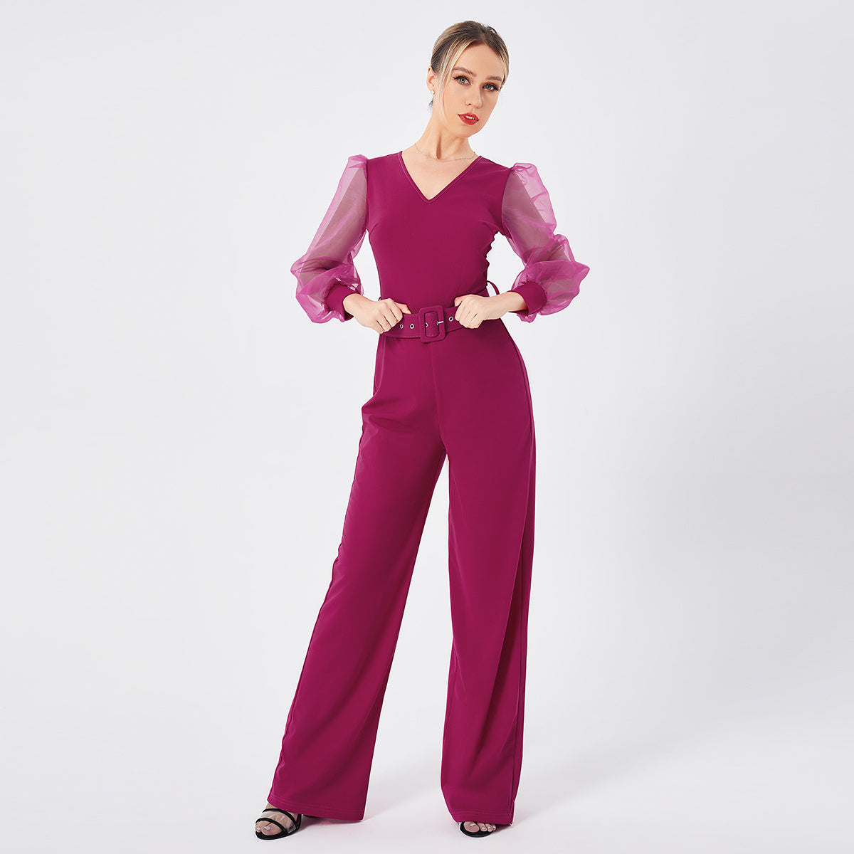 a woman in a pink jumpsuit