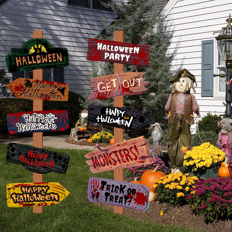 a group of signs in front of a house