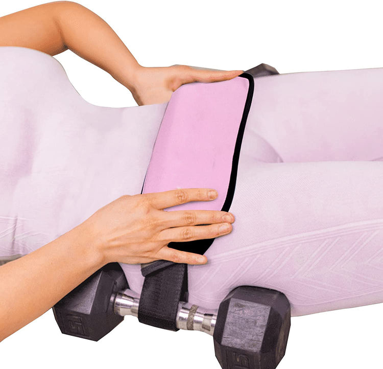 a person holding a pink towel over a woman's body