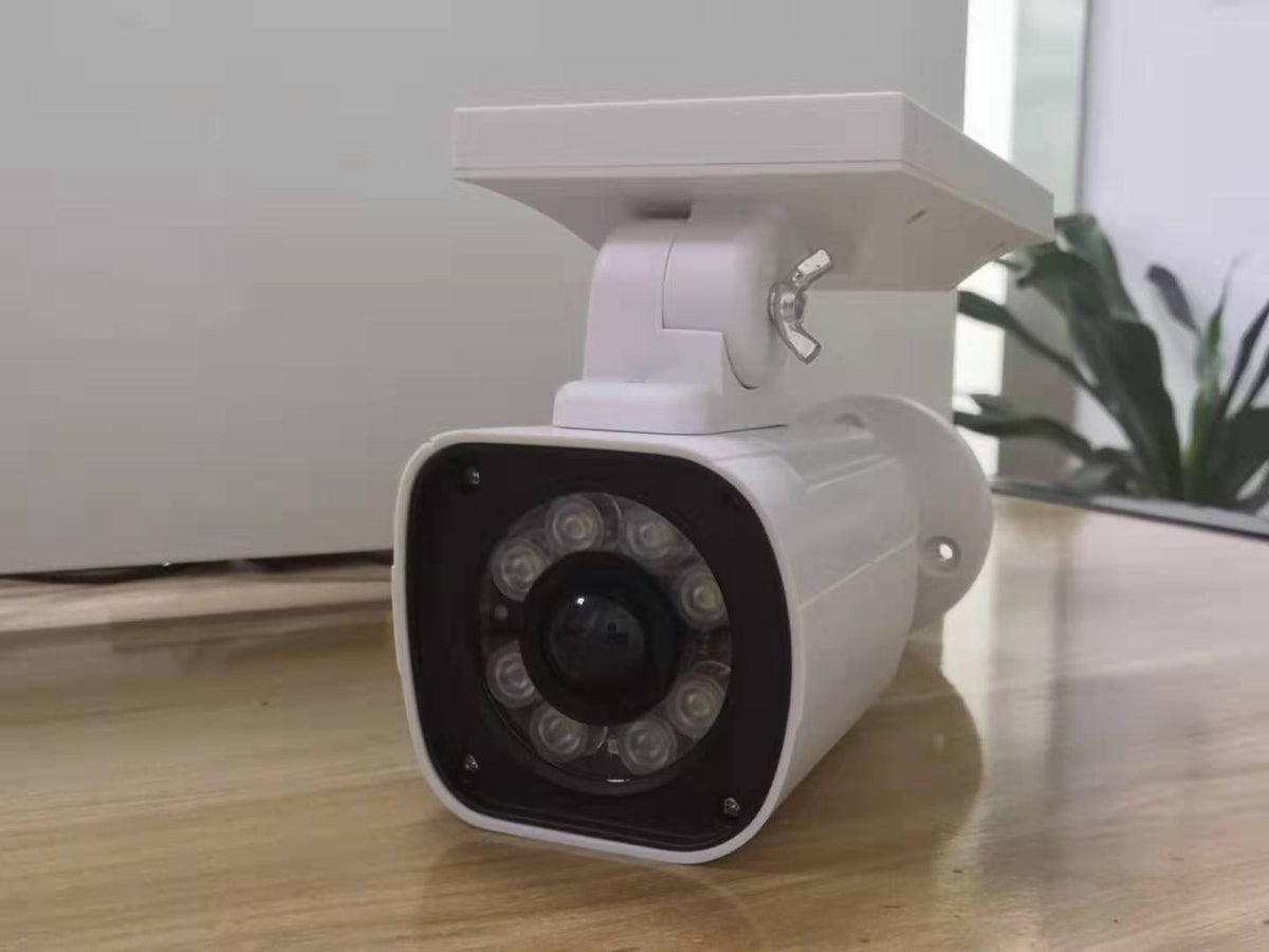 a white camera on a table