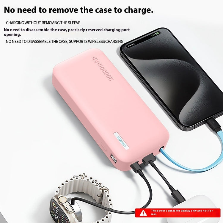a pink power bank next to a black phone