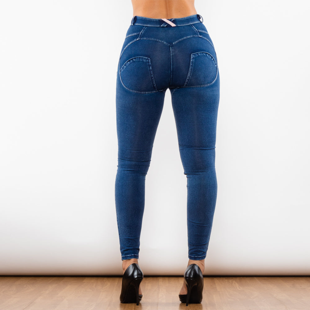 a woman wearing jeans and heels