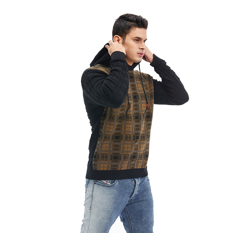 a man wearing a sweater and jeans